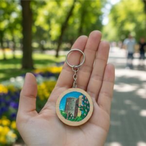 Hand-painted Maiden Tower on a circular natural wood keychain, 45mm diameter, 10g weight, by Artirs Family Craft.