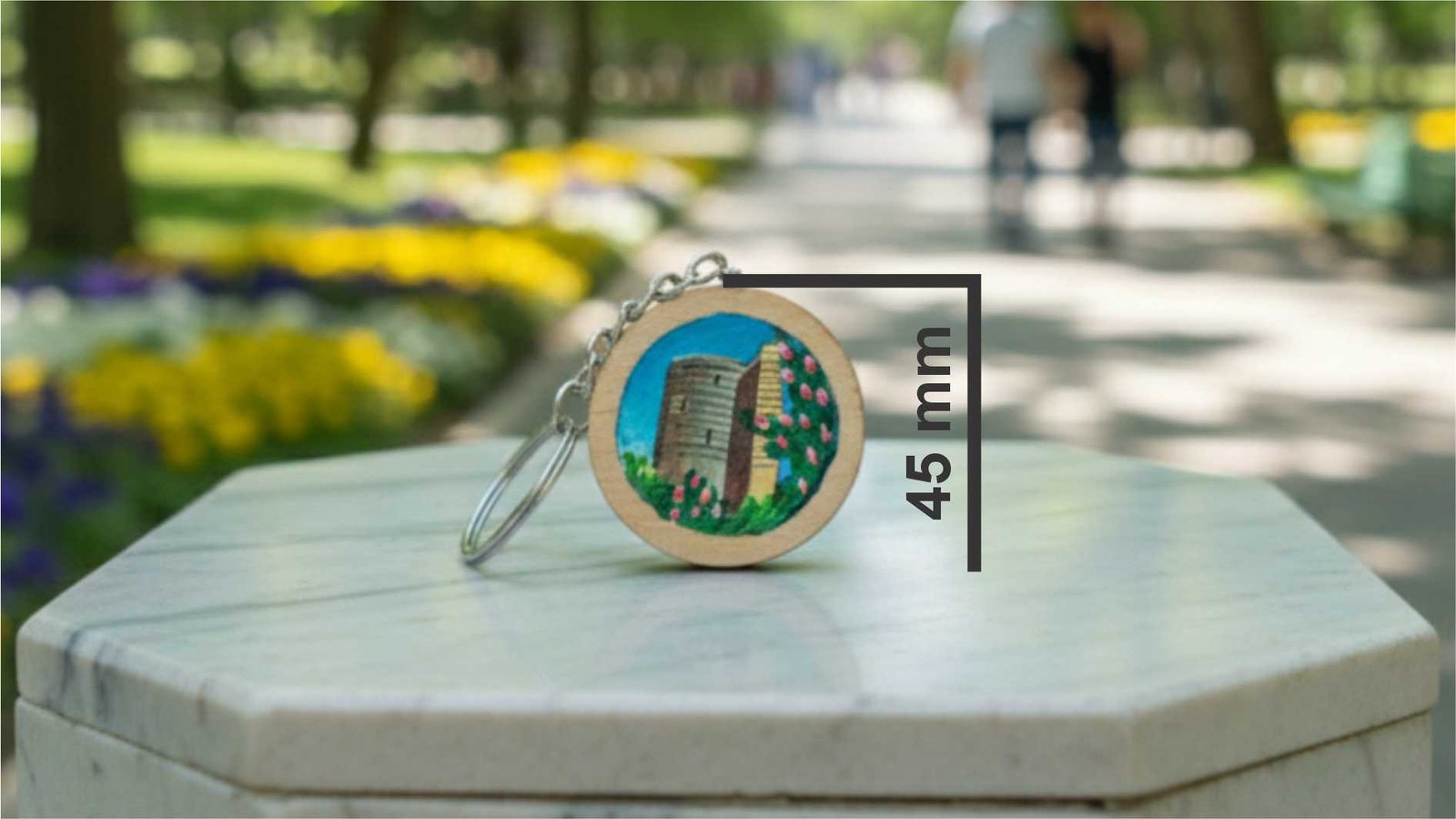 Hand-painted Maiden Tower on a circular natural wood keychain, 45mm diameter, 10g weight, by Artirs Family Craft.