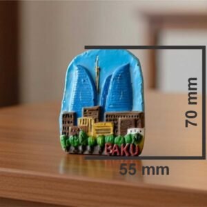 Handcrafted 3D ceramic relief magnet of the three Baku Flame Towers rising above traditional Azerbaijani houses with red-tiled roofs, by Gilchi Ceramics Art Studio.