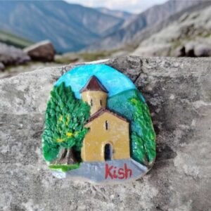 Handcrafted 3D ceramic relief magnet of the ancient Kish Albanian Temple in Sheki with lush green trees, made by Artirs Family Craft.